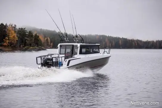 A fishing boat with multiple fishing rods speeds through a calm lake, surrounded by autumn-colored trees and misty hills.